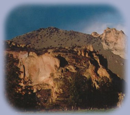 waterfalls at smith rock, flowing into the crooked river below.